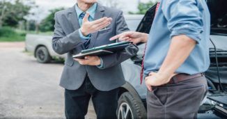 Men discussing after car accident